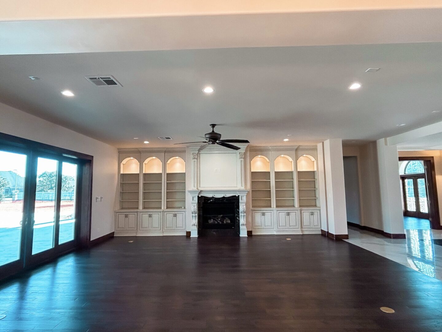 Spacious living room with built-in shelves.